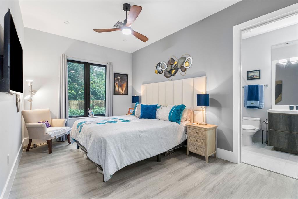 13500 Stirling Road Southwest Ranches, FL 33330 - Photo 49 of 72 a bedroom with a bed and a large window