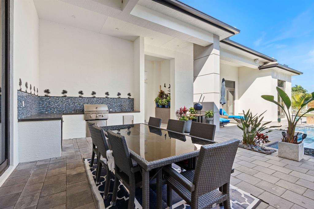 13500 Stirling Road Southwest Ranches, FL 33330 - Photo 66 of 72 a view of a dining table and chairs in patio