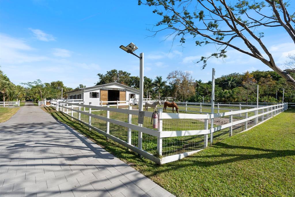 13500 Stirling Road Southwest Ranches, FL 33330 - Photo 69 of 72 a view of a house with a park