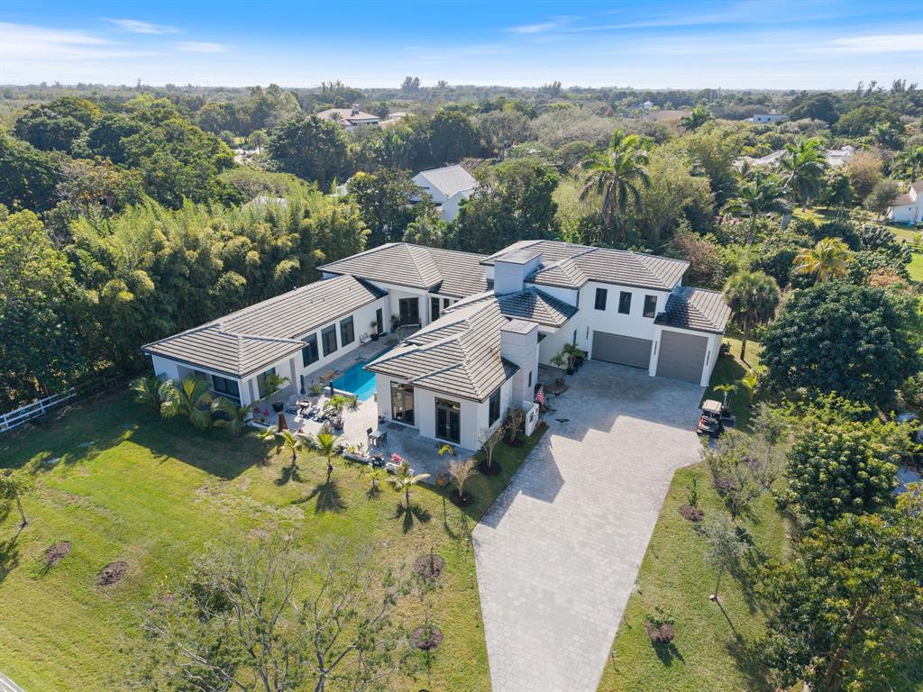 13500 Stirling Road Southwest Ranches, FL 33330 - Photo 78 of 83 an aerial view of a house with a garden