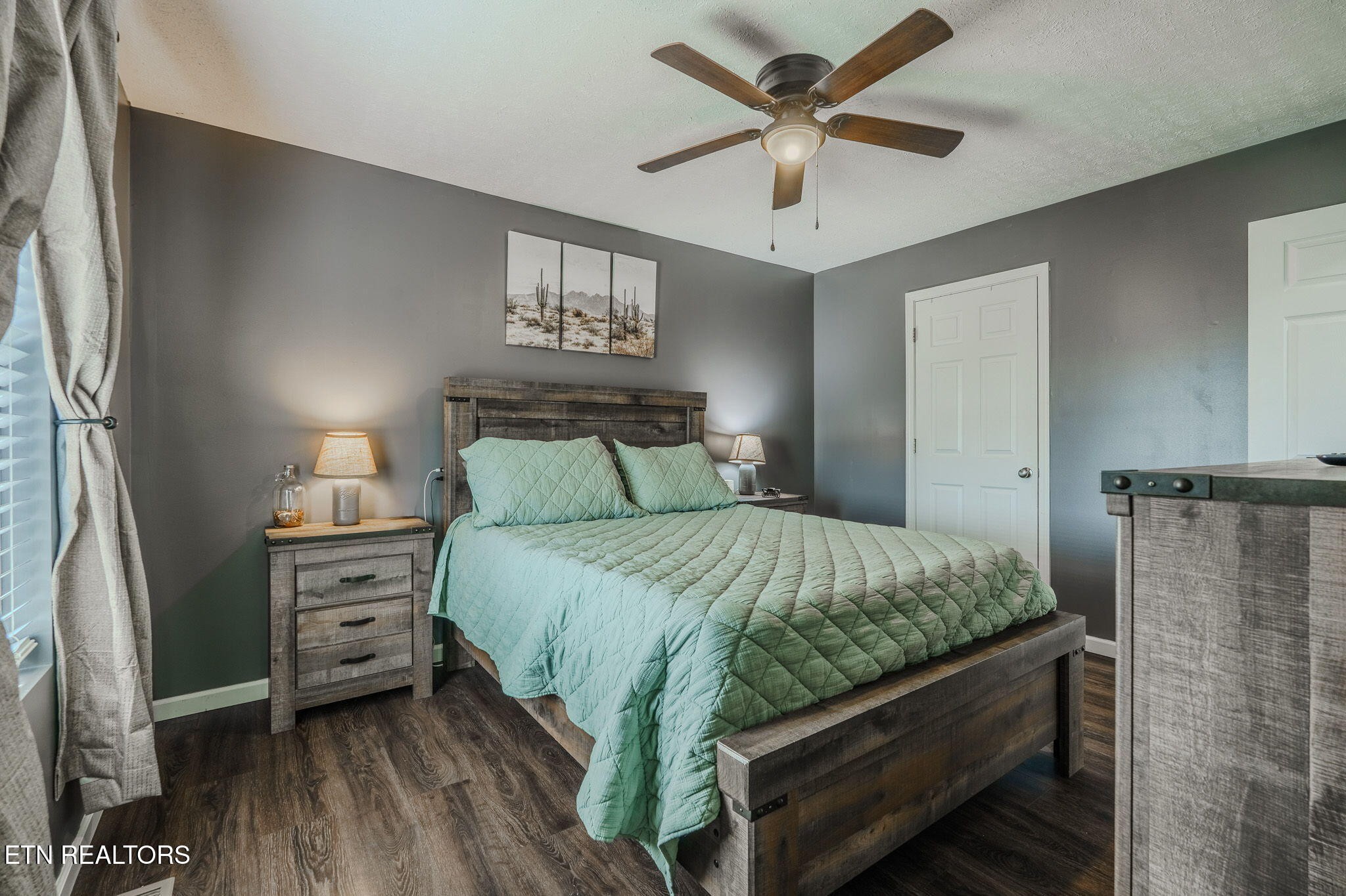 3215 Smith Road White Pine, TN 37890 - Photo 6 of 28 a bedroom with a bed and a chandelier
