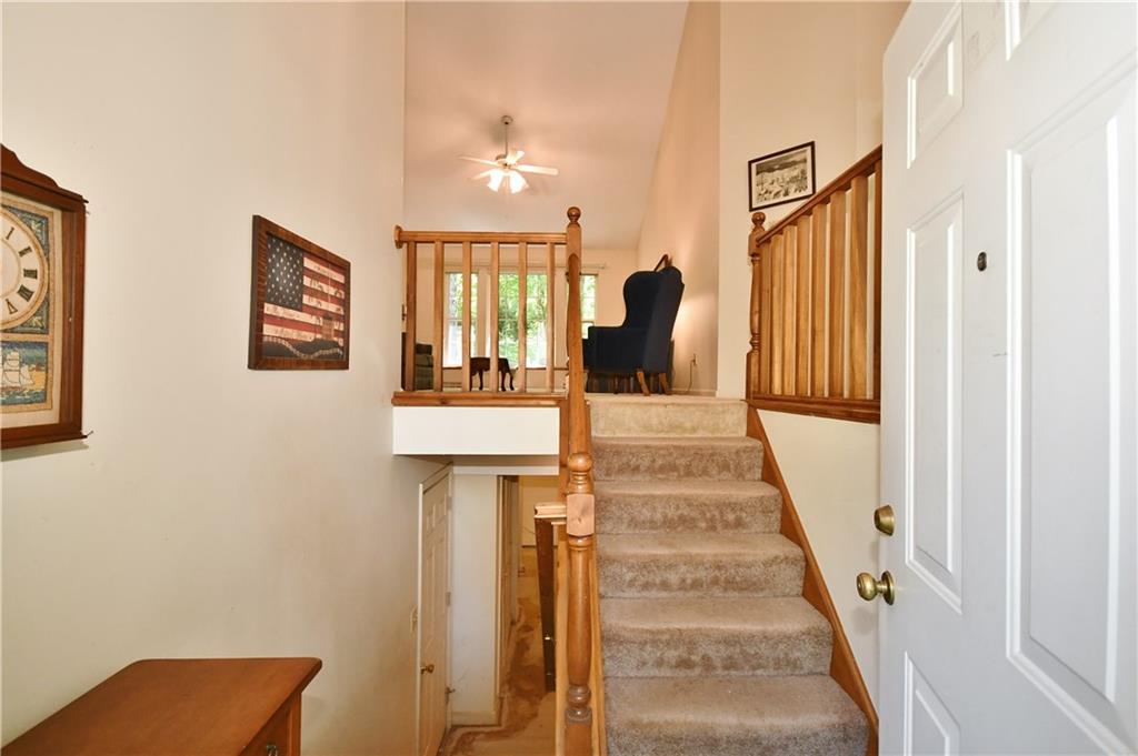 Open two story foyer leads to a great room with a vaulted ceiling.