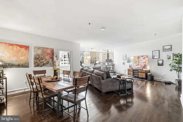 a view of a livingroom with furniture window and wooden floor