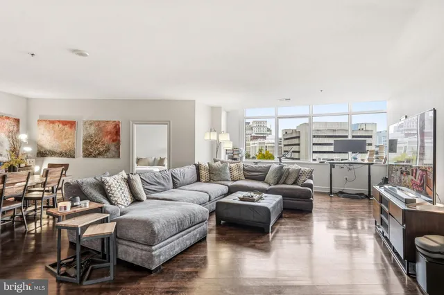 a living room with furniture and a large window