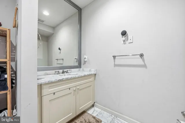 a bathroom with a sink and mirror