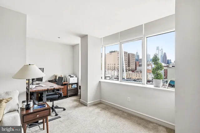 a workspace with furniture and a window