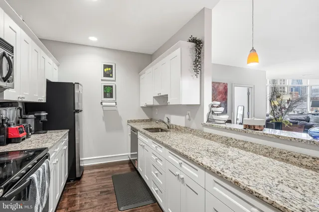 a kitchen with a sink stove and refrigerator