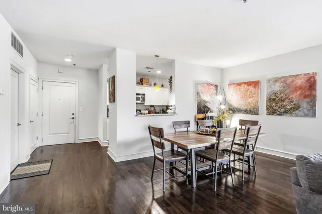 a view of a dining room with furniture and wooden floor