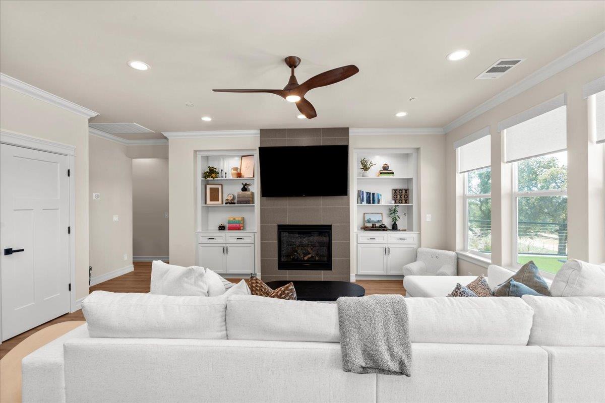 3775 Bell Road Auburn, CA 95603 - Photo 12 of 45 a living room with furniture a fireplace and a large window