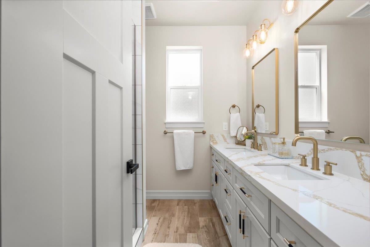 3775 Bell Road Auburn, CA 95603 - Photo 28 of 45 a bathroom with a double vanity sink and mirror
