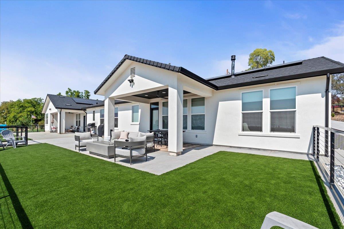 3775 Bell Road Auburn, CA 95603 - Photo 34 of 45 a view of a house with a backyard and a patio