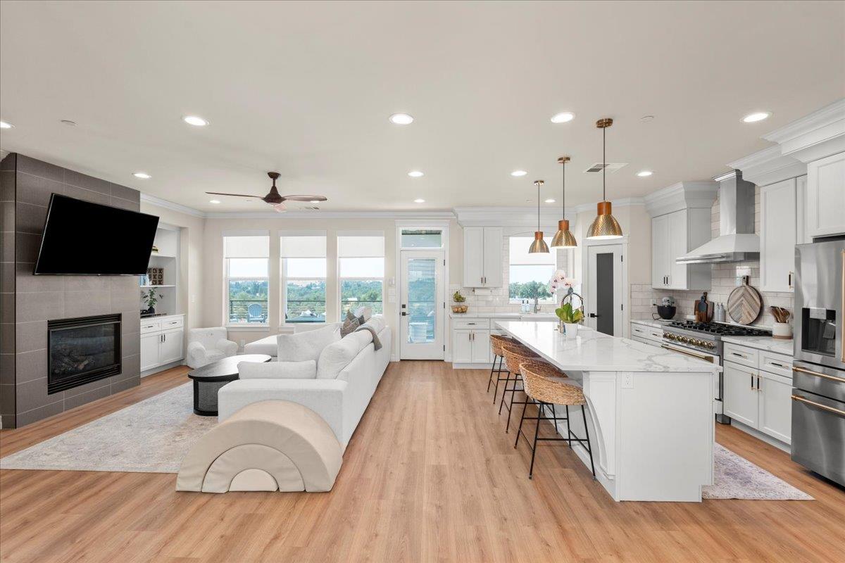 3775 Bell Road Auburn, CA 95603 - Photo 10 of 45 a living room with stainless steel appliances furniture fireplace and a flat screen tv
