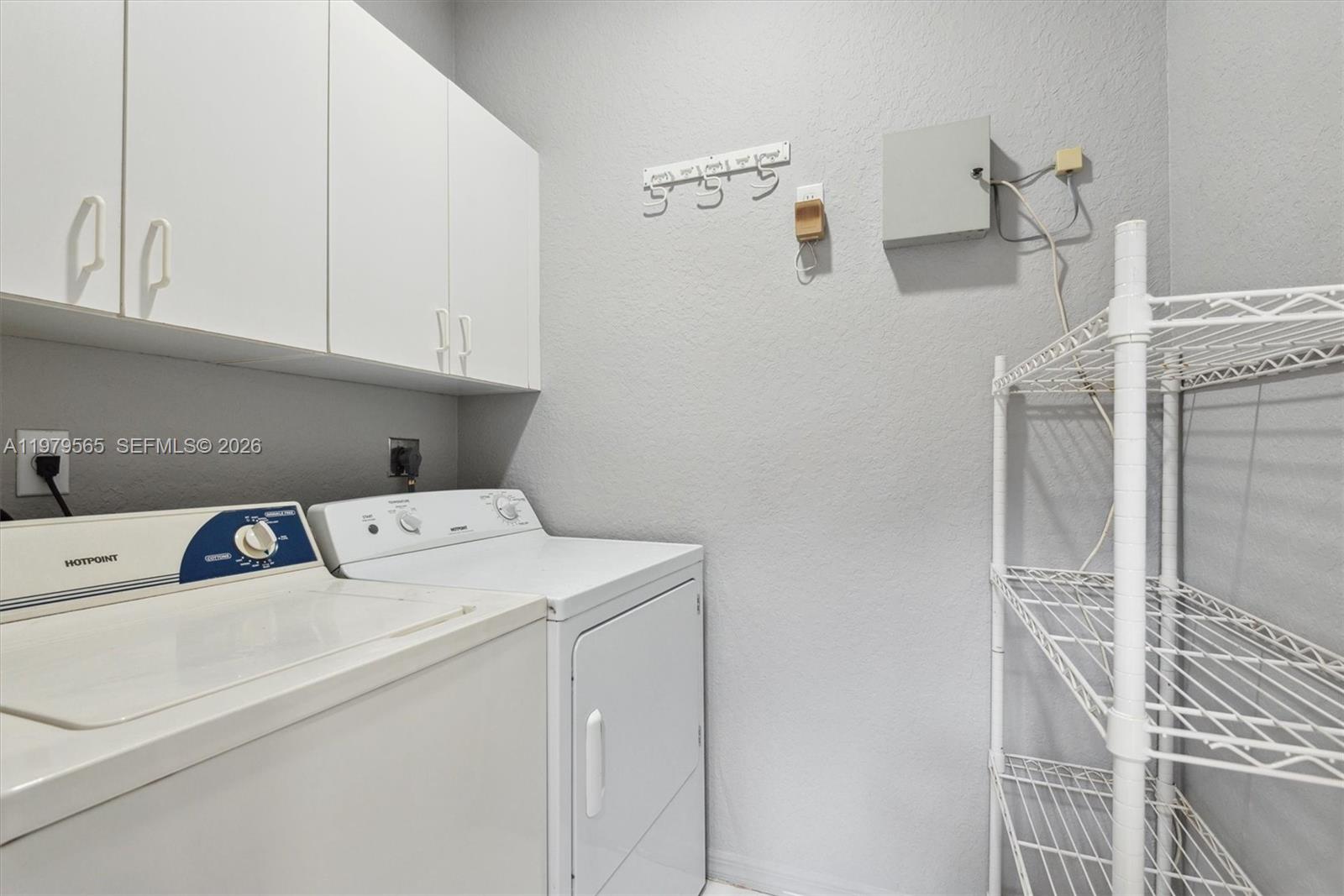 7234 Panache Way Boca Raton, FL 33433 - Photo 12 of 23 a utility room with dryer and washer