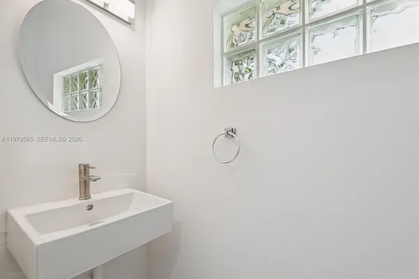 a bathroom with a sink and a mirror