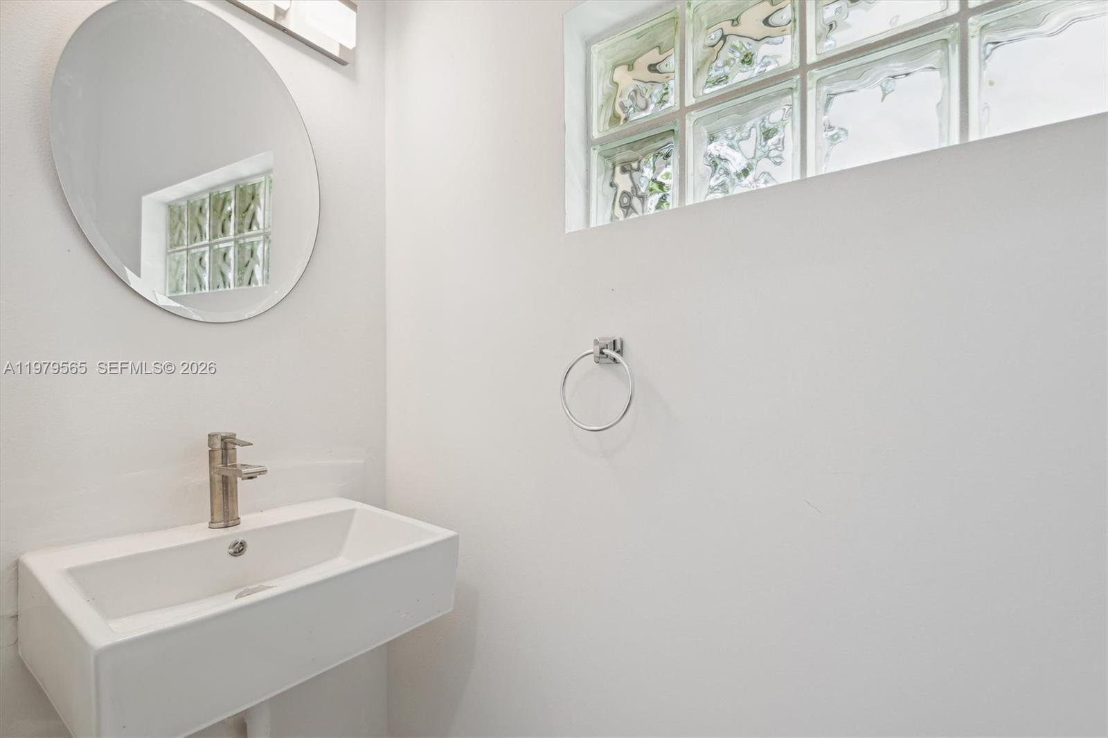 7234 Panache Way Boca Raton, FL 33433 - Photo 13 of 23 a bathroom with a sink and a mirror
