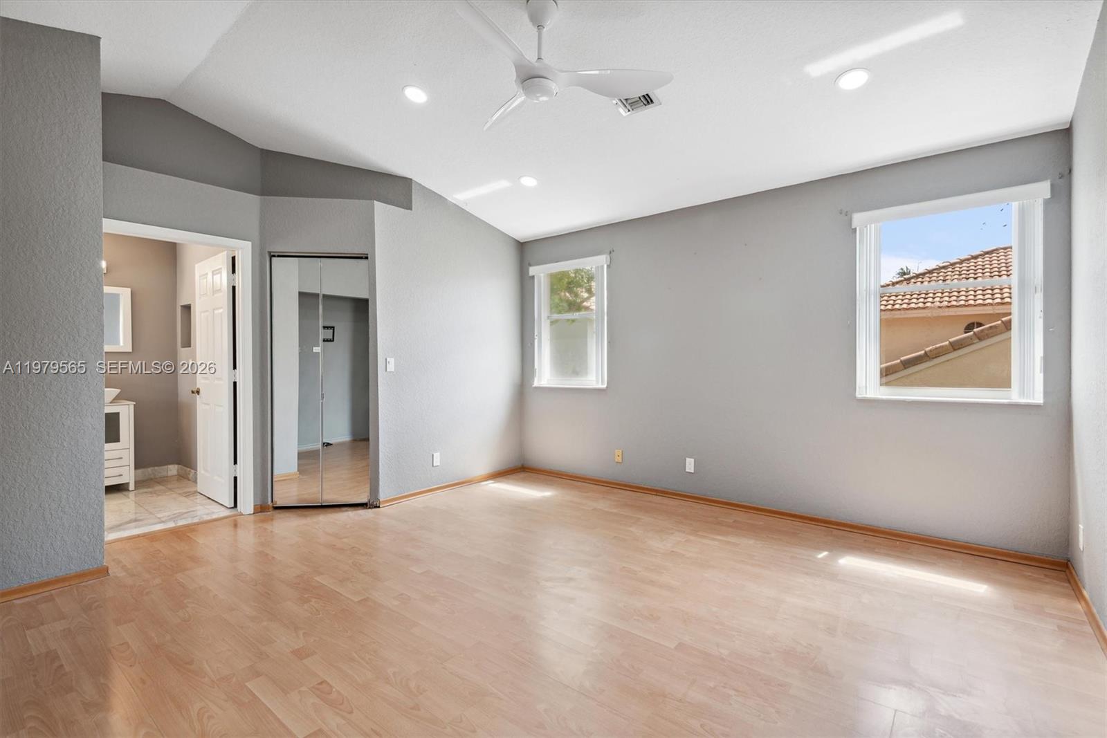 7234 Panache Way Boca Raton, FL 33433 - Photo 14 of 23 an empty room with windows and closet