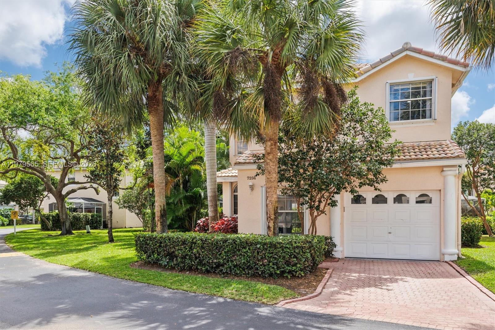 7234 Panache Way Boca Raton, FL 33433 - Photo 2 of 23 front view of a house with a garden