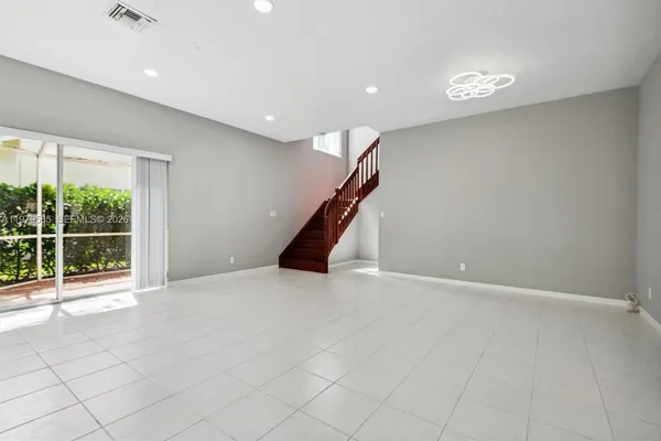 a view of an empty room with a window
