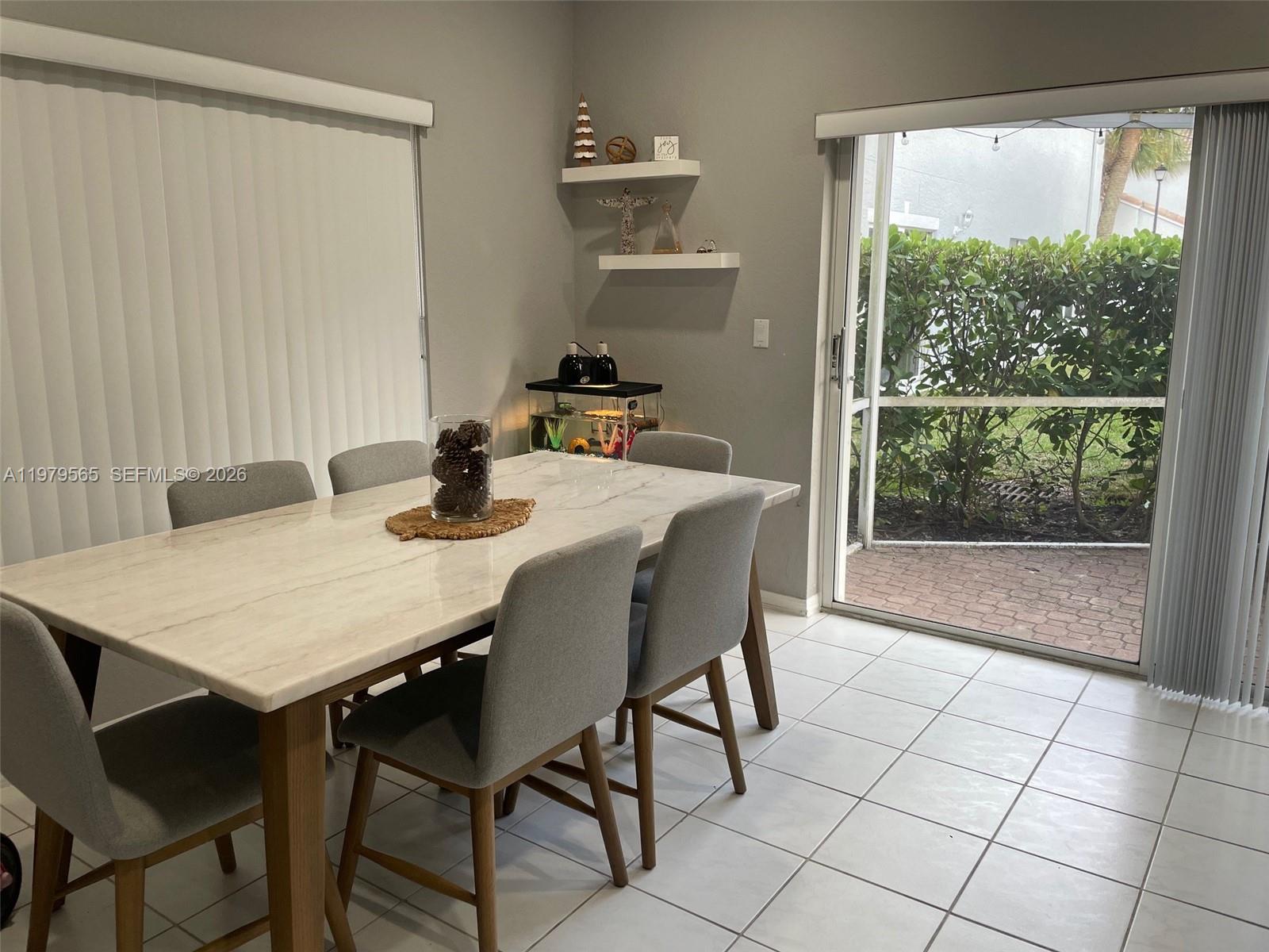 7234 Panache Way Boca Raton, FL 33433 - Photo 8 of 23 a dining room with furniture and window