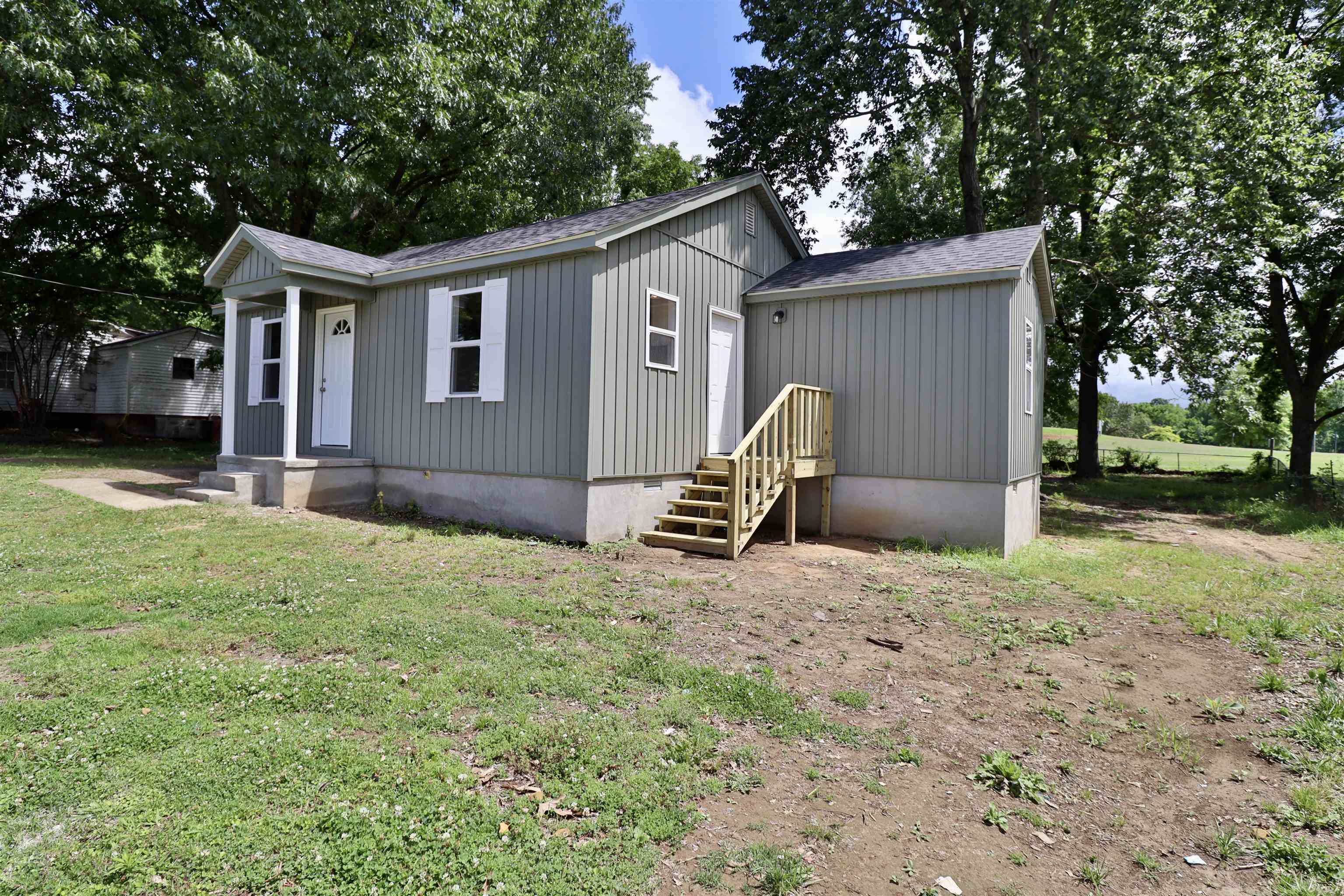 224 Kellar Avenue Ripley, TN 38063 - Photo 22 of 30 a backyard of a house with barbeque oven