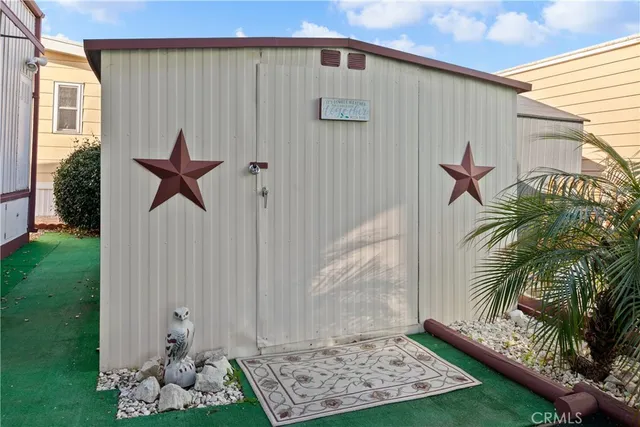 a view of a house with swimming pool and sitting area