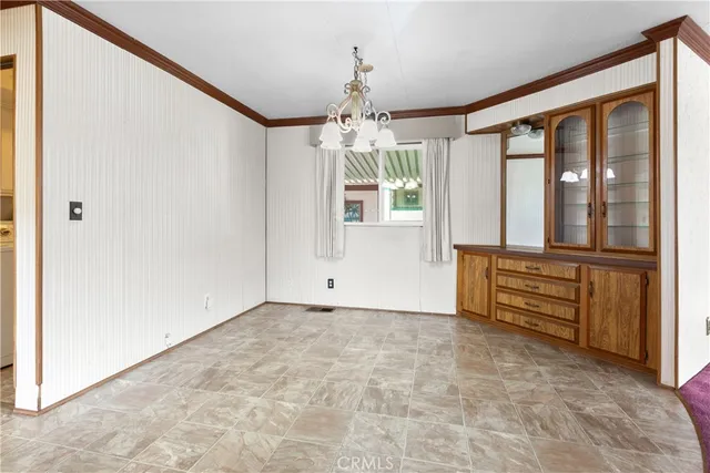a kitchen with stainless steel appliances granite countertop a refrigerator and a stove