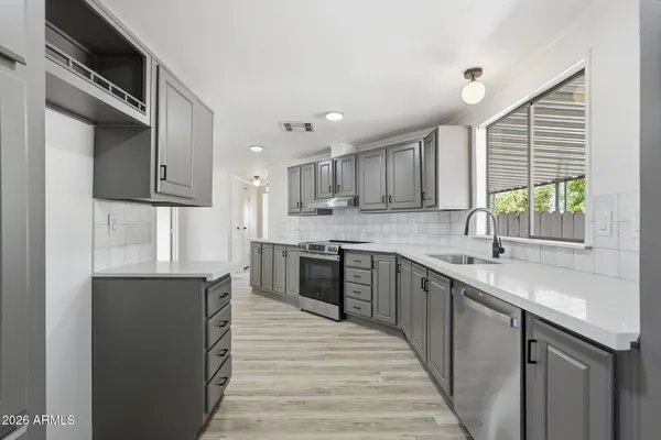 a view of a kitchen with a wooden floor