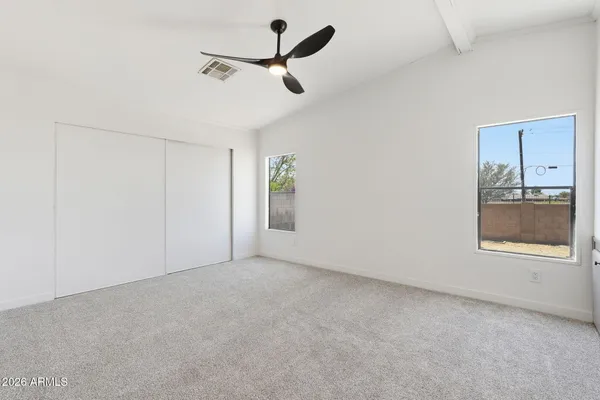 a kitchen with stainless steel appliances granite countertop a stove cabinets and wooden floor