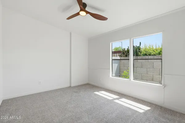 a bathroom with a sink tub double vanity and mirror