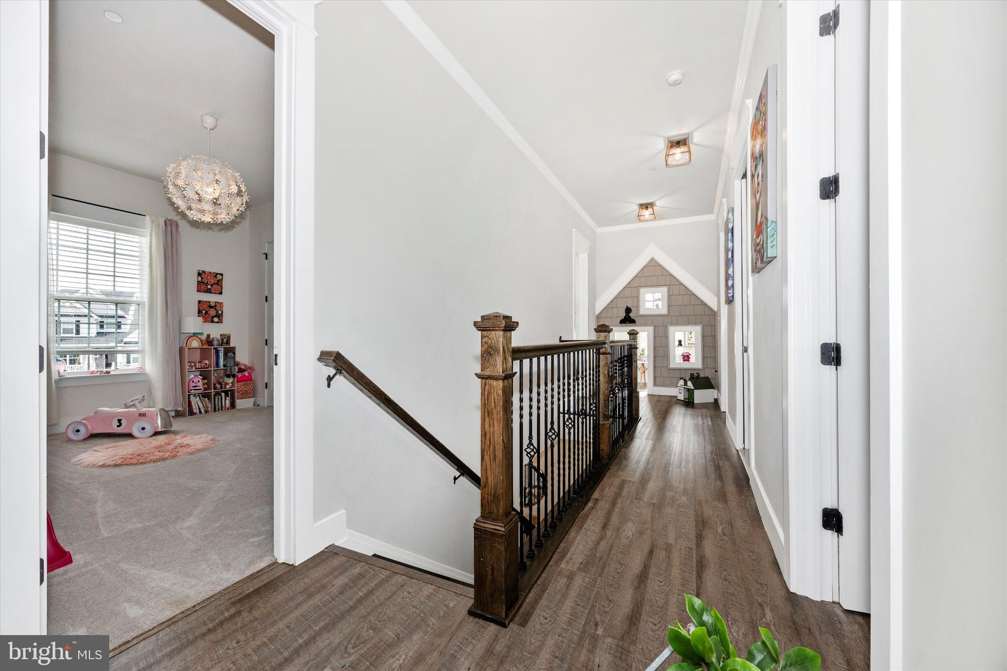 1694 Double Bank Road Frederick, MD 21702 - Photo 20 of 79 a view of a hallway with wooden floor and stairs