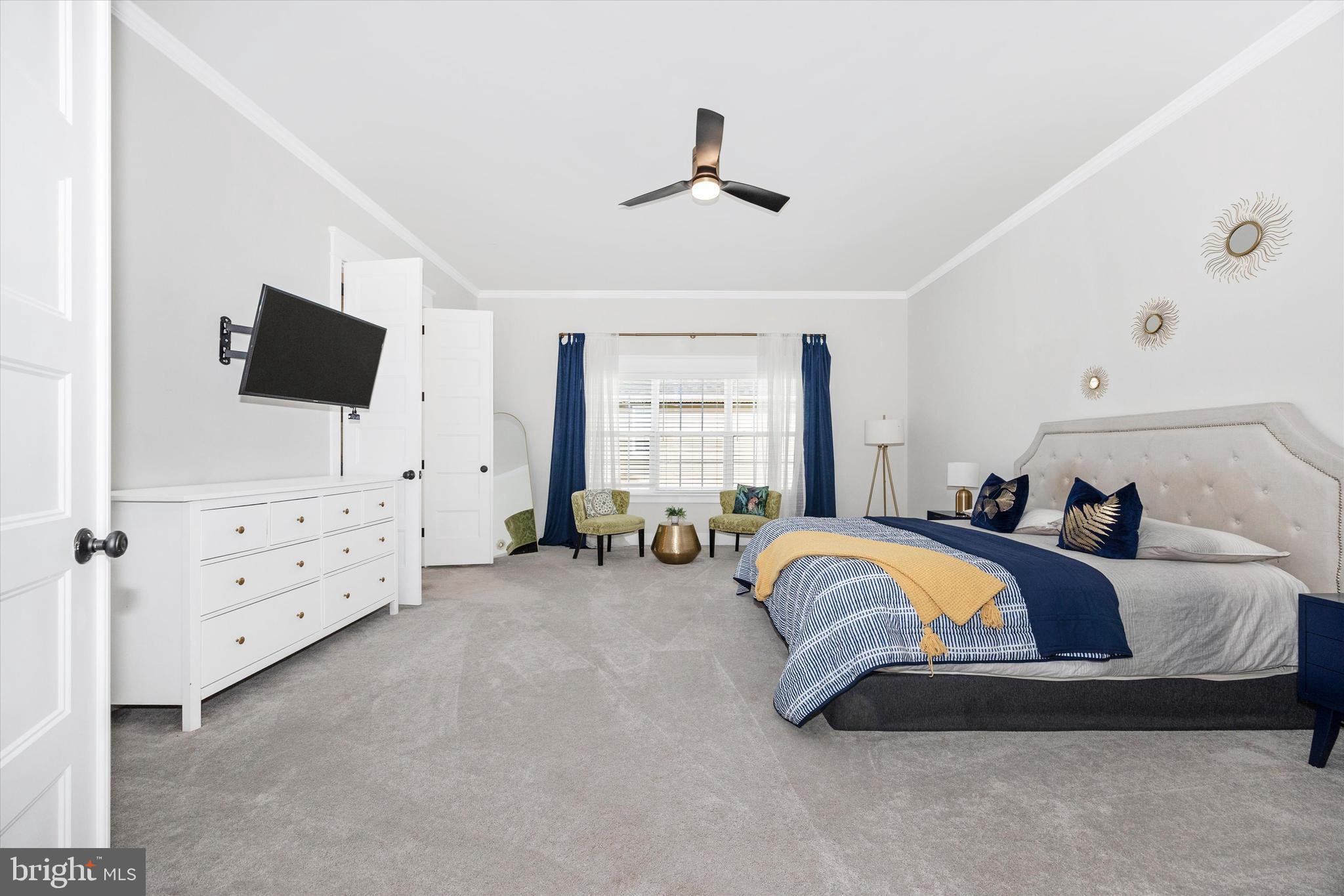 1694 Double Bank Road Frederick, MD 21702 - Photo 21 of 79 a spacious bedroom with a bed and flat screen tv