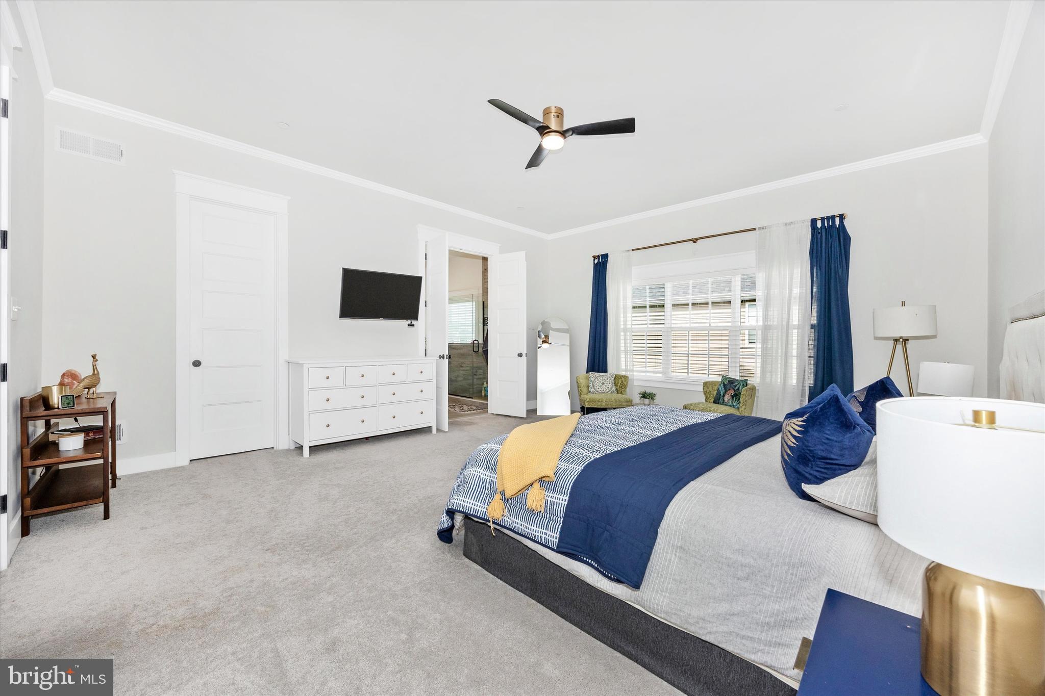1694 Double Bank Road Frederick, MD 21702 - Photo 22 of 79 a bedroom with a bed and a flat tv screen