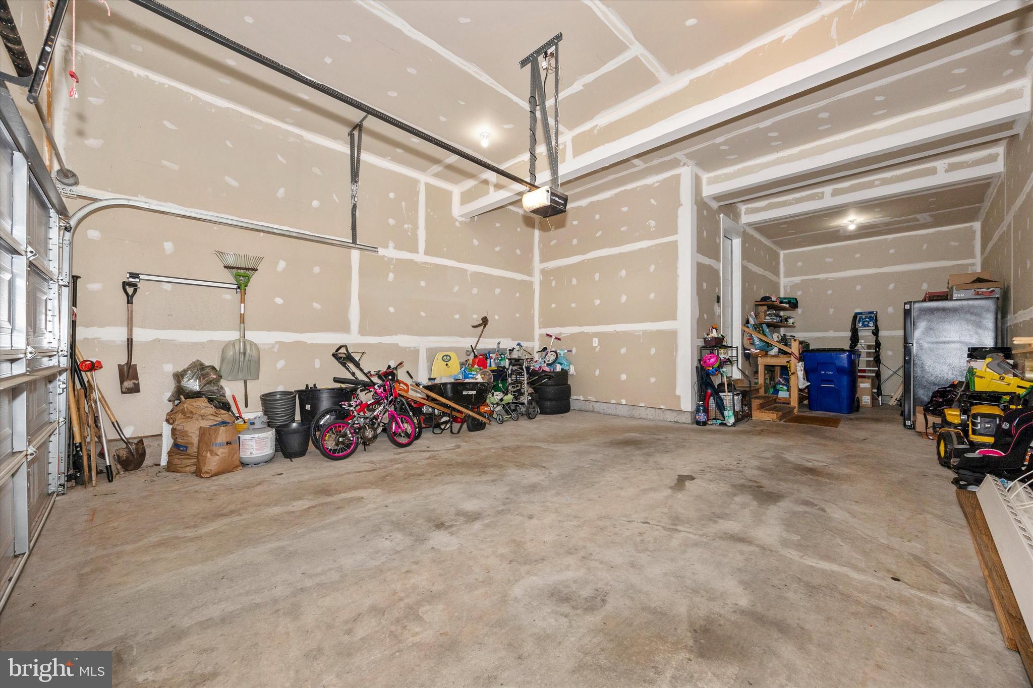 1694 Double Bank Road Frederick, MD 21702 - Photo 36 of 79 a view of a garage with a bike and car
