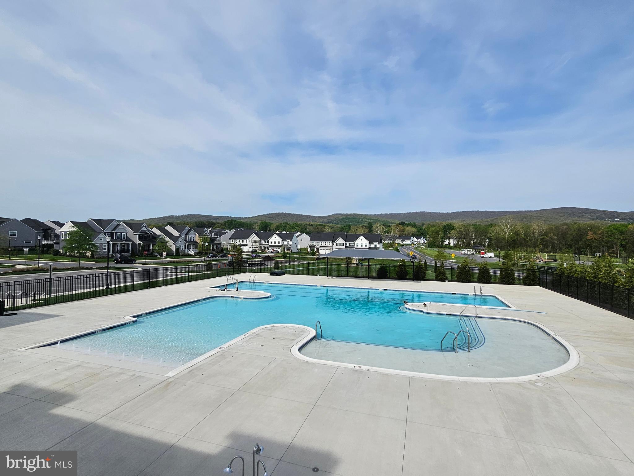 1694 Double Bank Road Frederick, MD 21702 - Photo 61 of 79 a view of swimming pool with outdoor seating and plants
