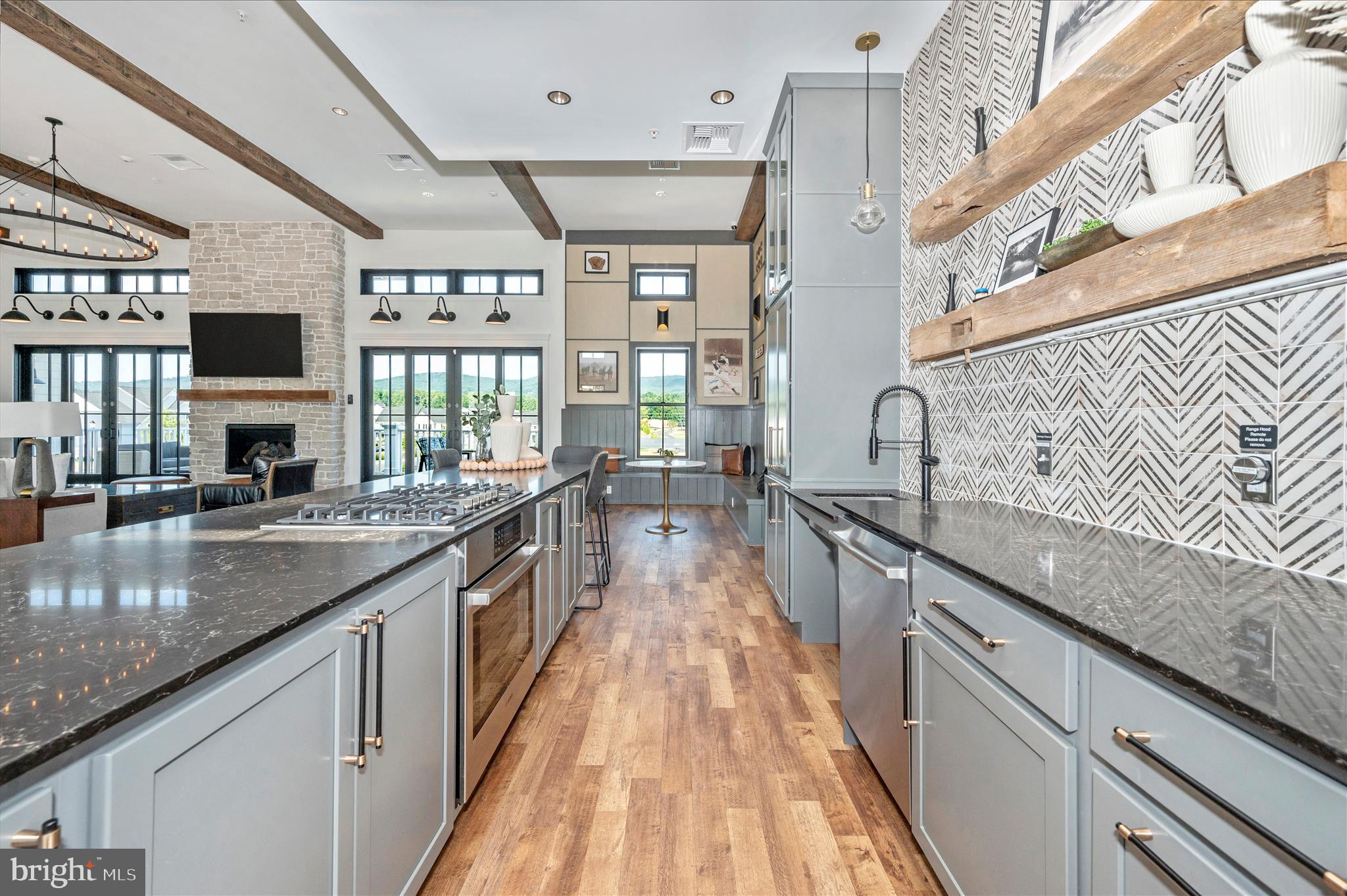 1694 Double Bank Road Frederick, MD 21702 - Photo 66 of 79 a view of a kitchen with stainless steel appliances granite countertop a sink and wooden floor