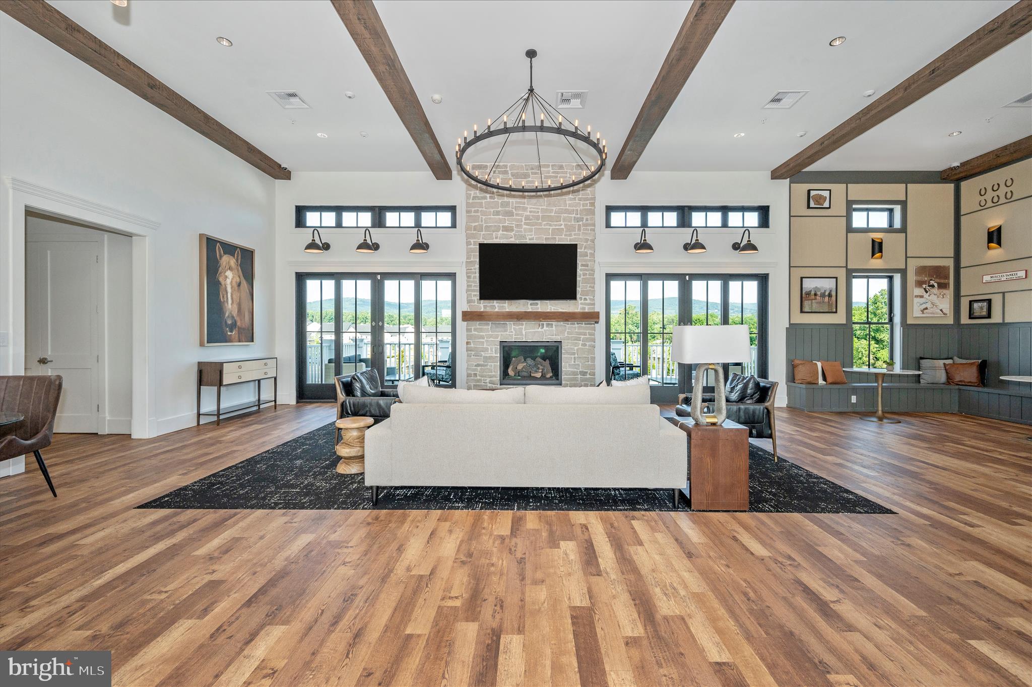 1694 Double Bank Road Frederick, MD 21702 - Photo 67 of 79 a living room with furniture a large window and a fireplace
