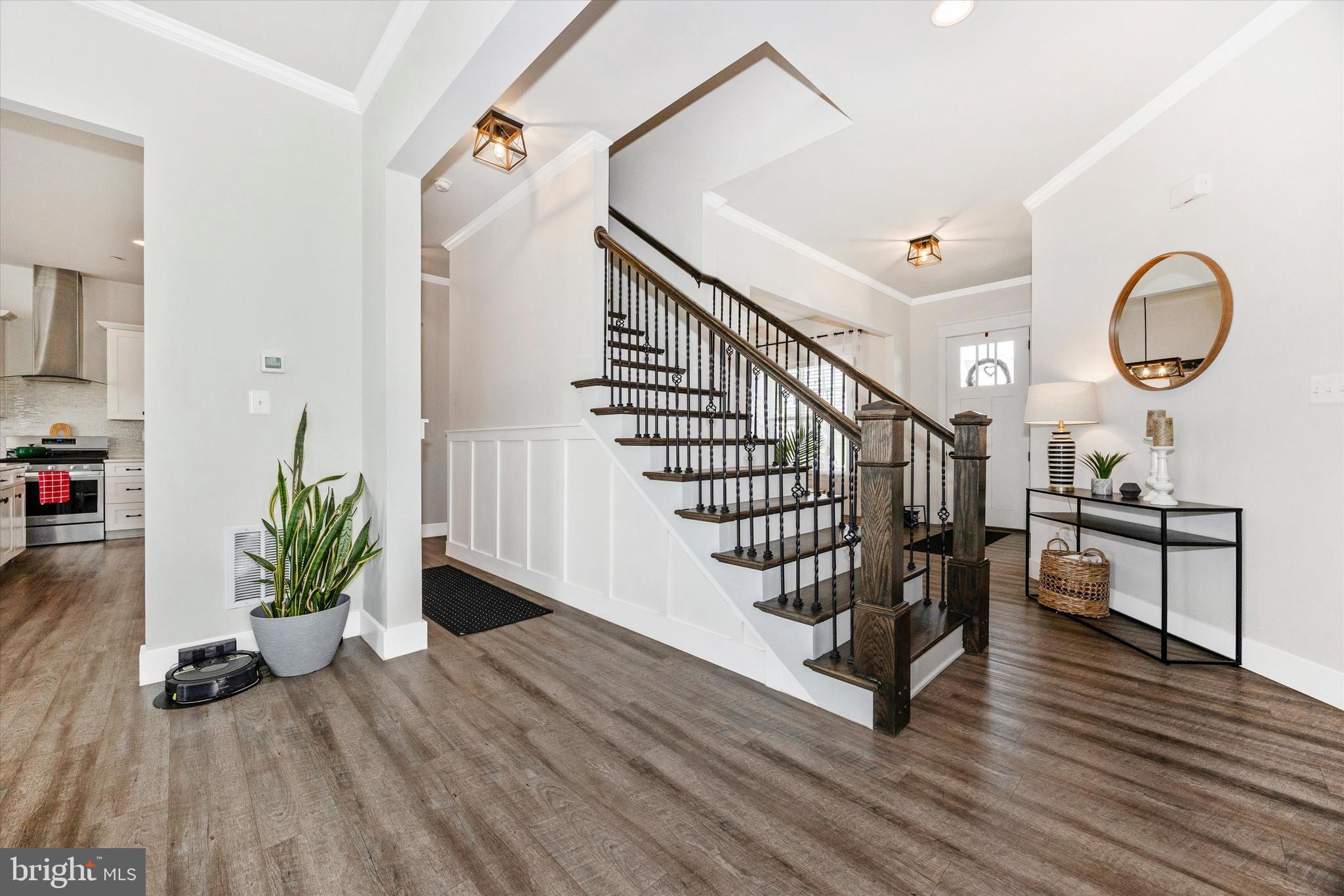 1694 Double Bank Road Frederick, MD 21702 - Photo 8 of 79 a view of a hallway with wooden floor and staircase