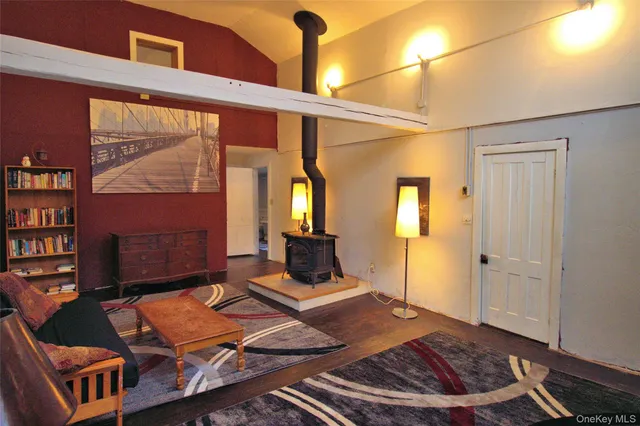 a living room with furniture and a rug