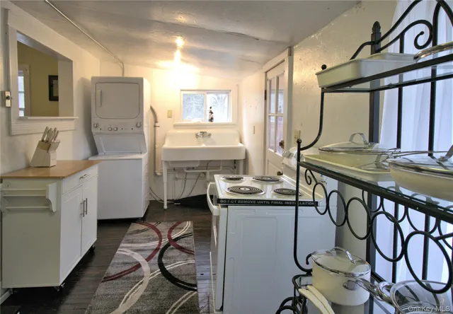 a kitchen with stainless steel appliances granite countertop a sink and cabinets