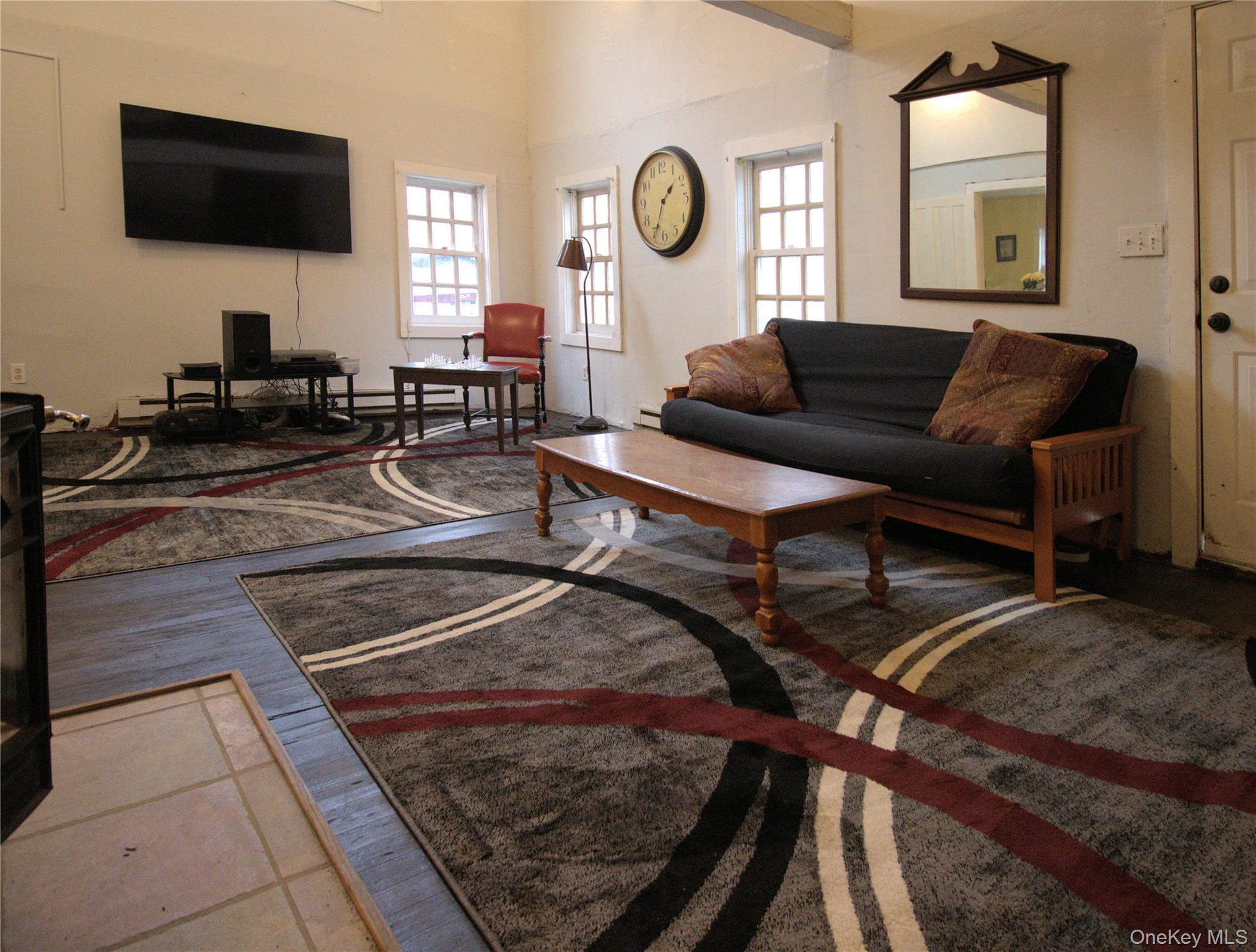 7 State Rte 55 Napanoch, NY 12458 - Photo 14 of 38 a living room with furniture and a flat screen tv