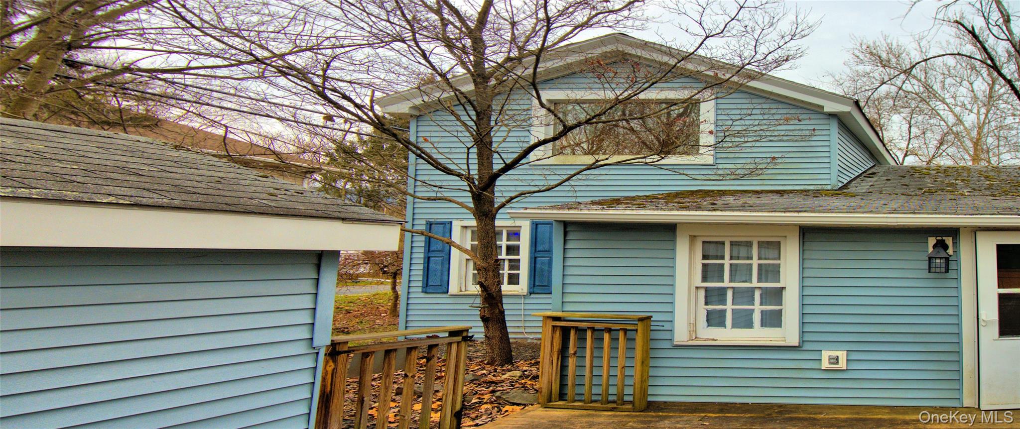 7 State Rte 55 Napanoch, NY 12458 - Photo 26 of 38 a small white building with a white roof and table and chairs under an umbrella