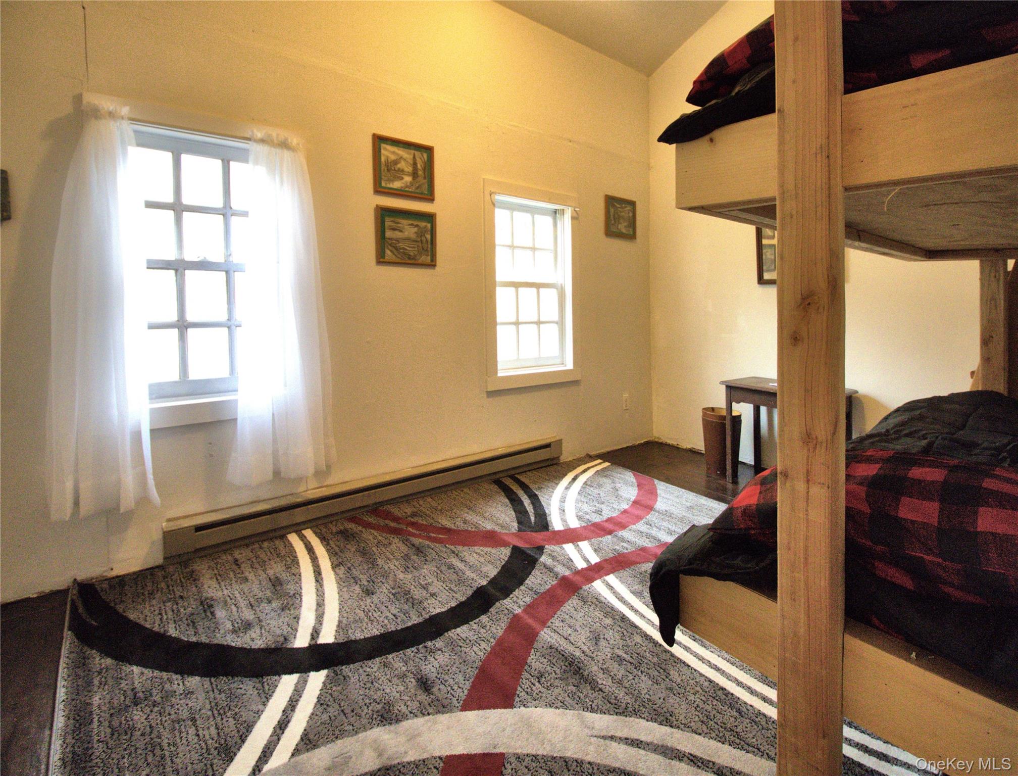 7 State Rte 55 Napanoch, NY 12458 - Photo 27 of 38 a bed sitting in a bedroom next to a window