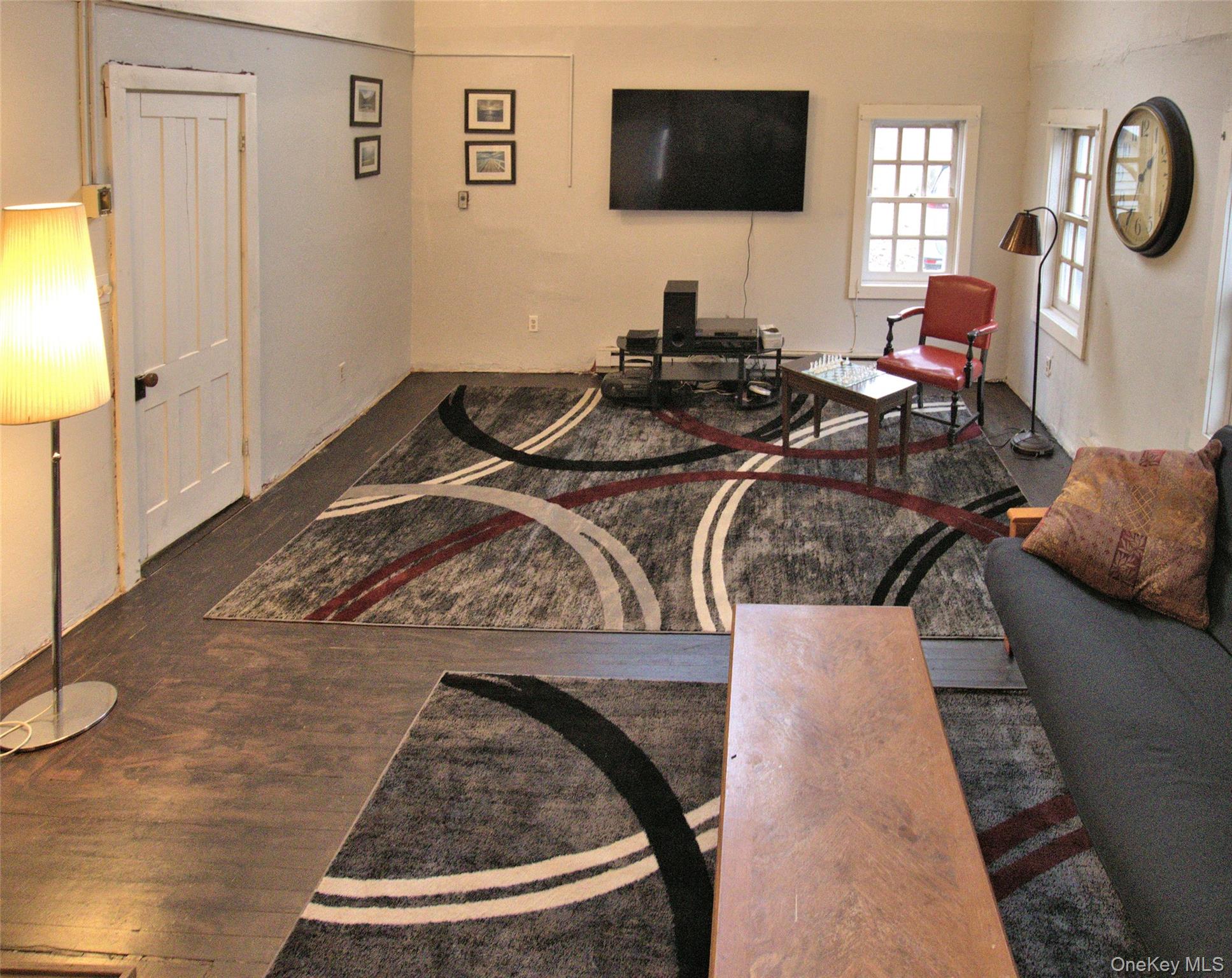 7 State Rte 55 Napanoch, NY 12458 - Photo 35 of 38 a living room with furniture and a flat screen tv