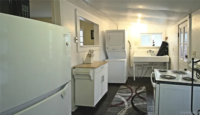 a kitchen with a refrigerator and a stove