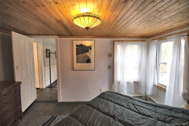 a bedroom with furniture and a window