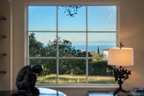a view of living room filled with furniture and wooden floor
