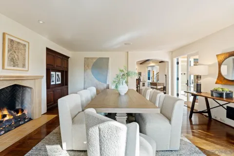 a view of a porch with wooden floor and seating space