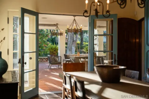 a living room with a bed furniture and a large window