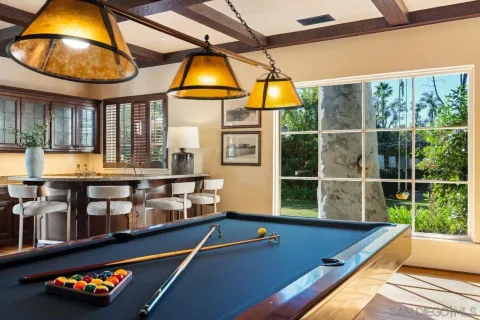 a view of bedroom with furniture and windows
