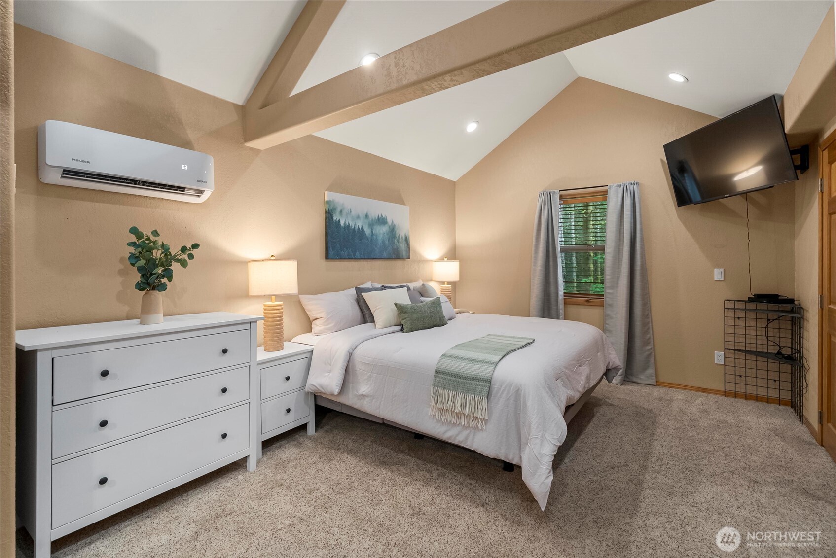 1546 Reservation Road Southeast, Unit 149 Olympia, WA 98513 - Photo 12 of 38 a spacious bedroom with a large bed and a flat screen tv